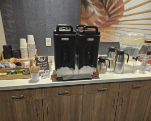 Breakroom coffee bar with Guatemalan and Brazilian small-batch roasted coffee.